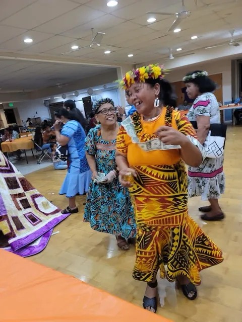 Women dancing at a church celebration.